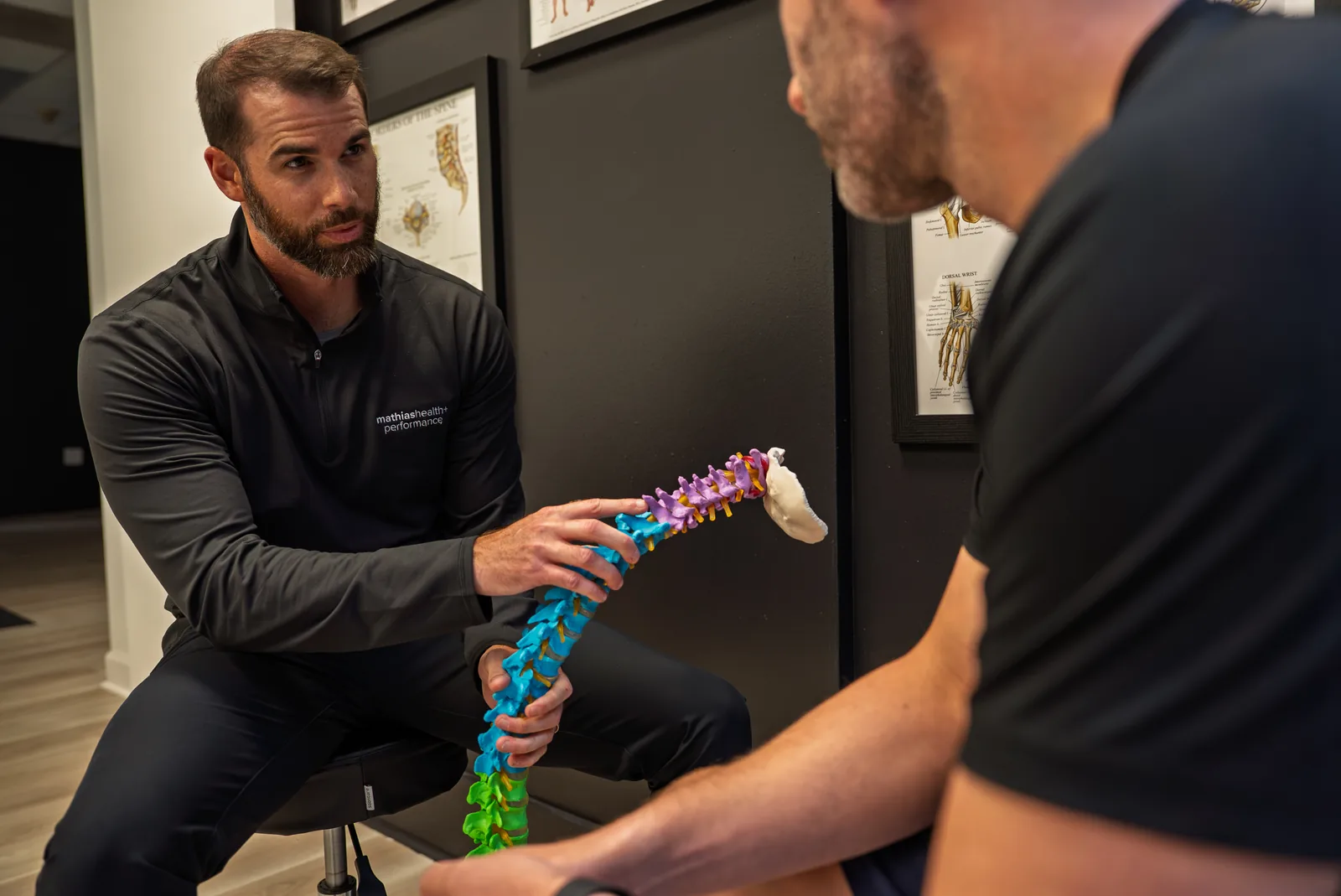 Dr. Mathias explaining the spine using an anatomical model