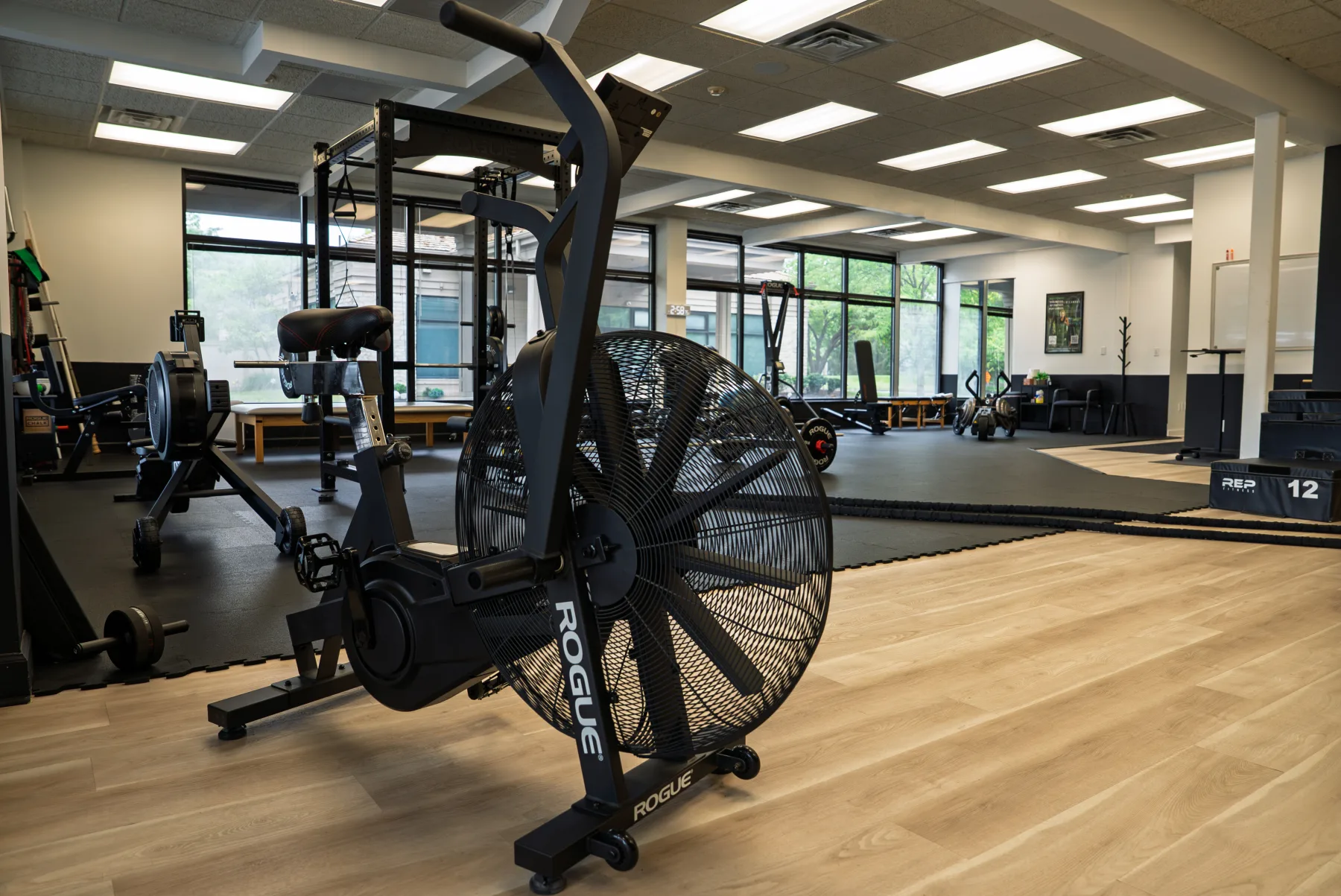 Weight room and racks at Mathias Health and Performance