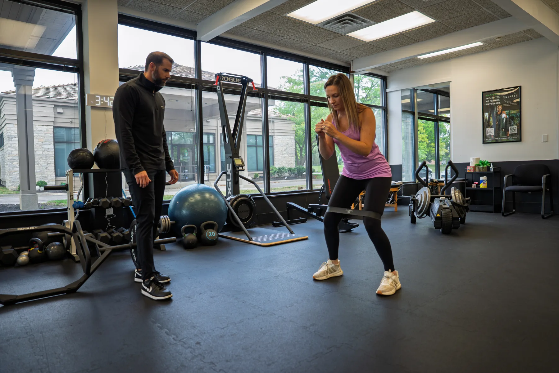 Haley performing a band squat during a mobility and training session