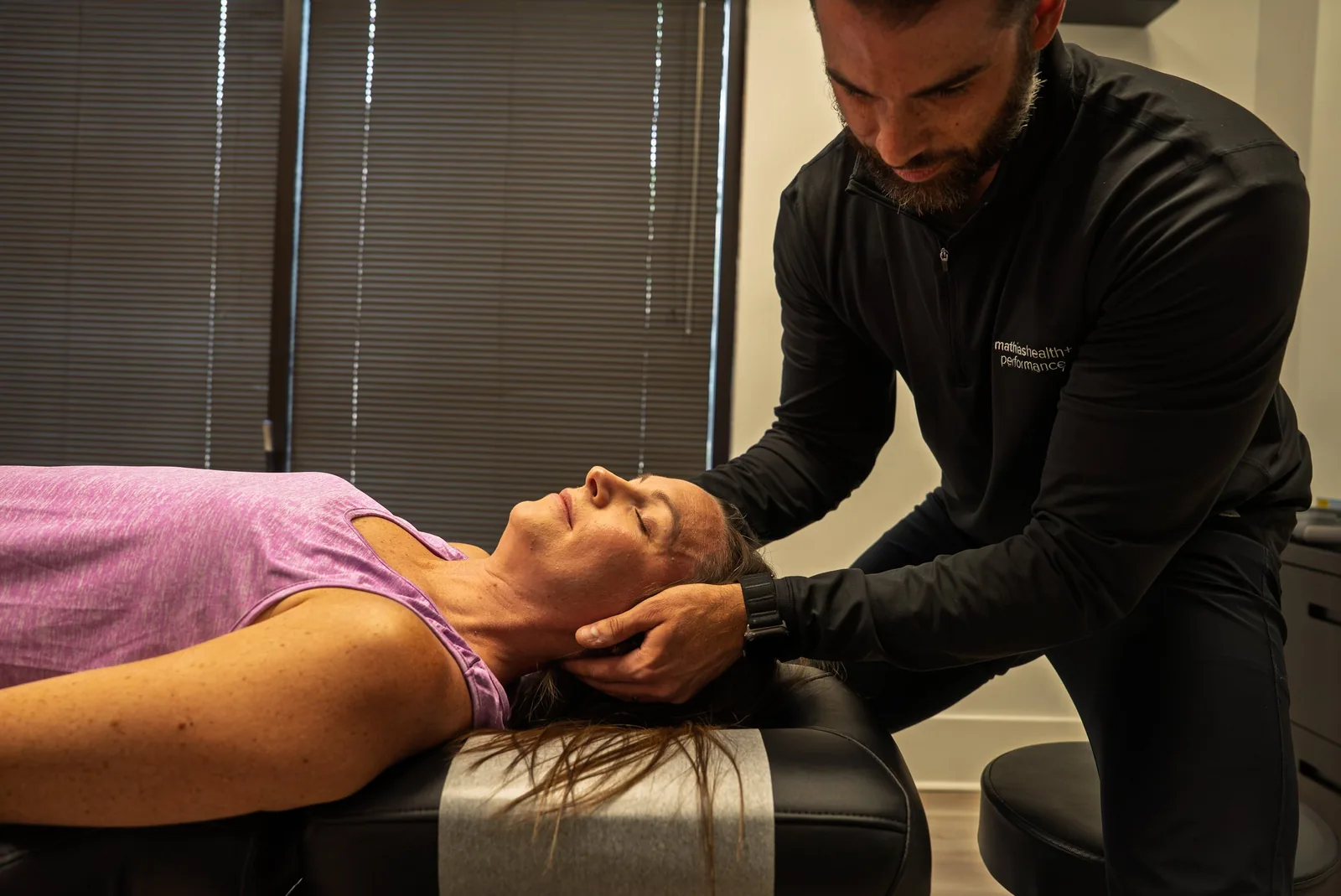 Dr. Mathias performing a neck adjustment